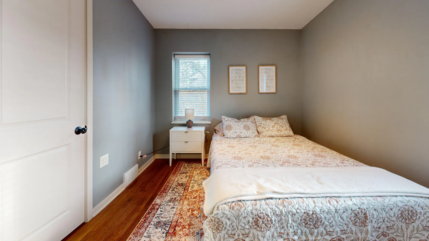 Clean, simply furnished bedroom with an accessible floor area