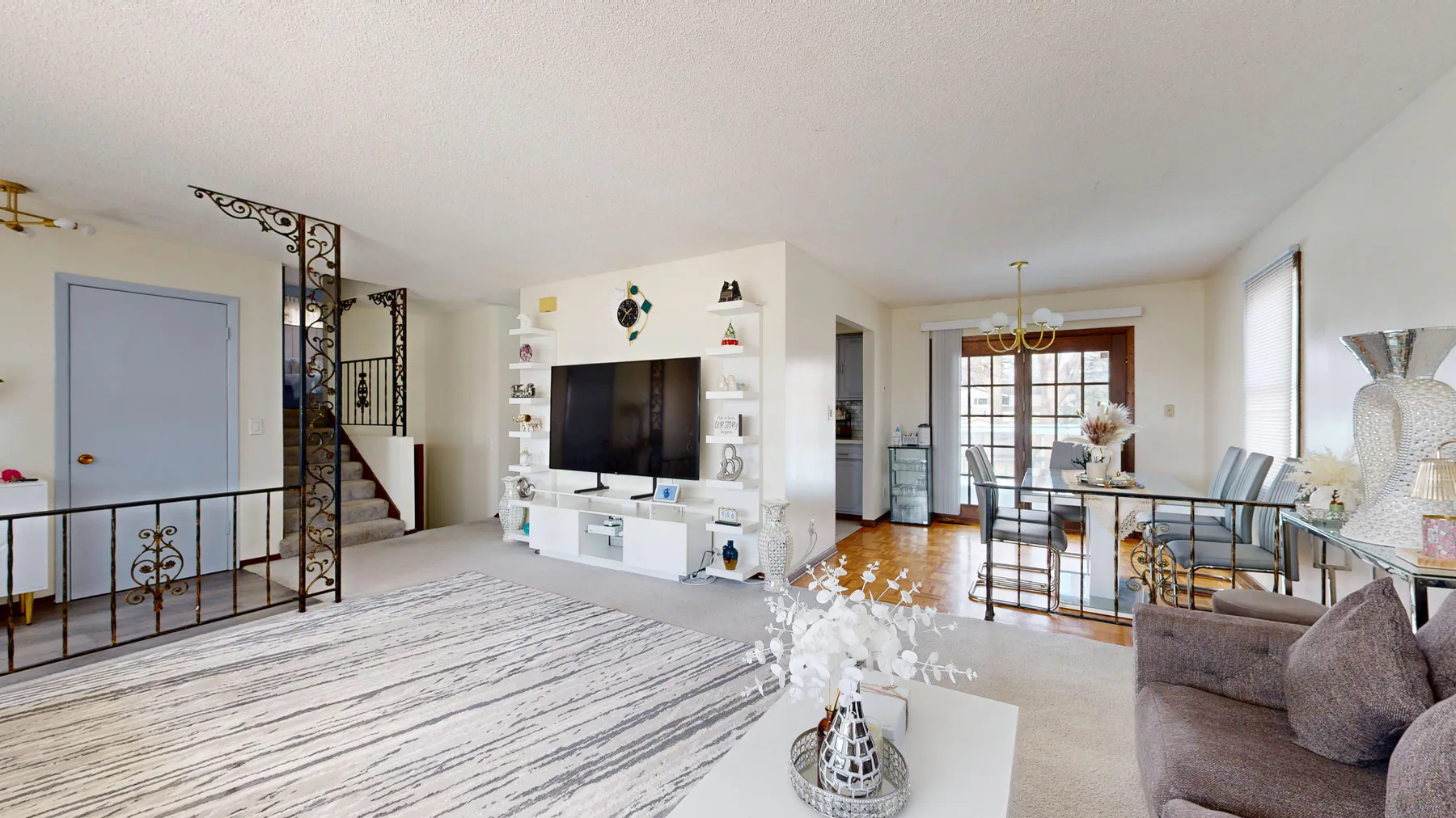 Clean open-plan living and dining room with organized furnishings